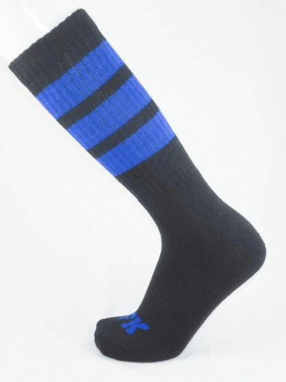 Fk sport black tube sock with two bold blue stripes near the top and a small blue logo on the toe
