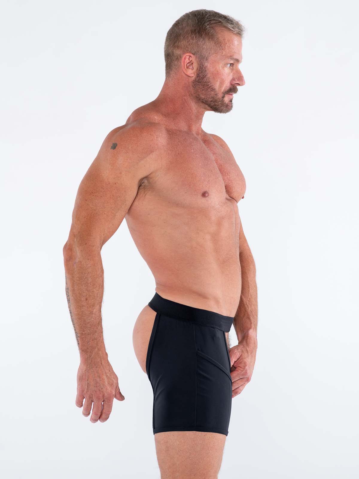 Black high-waisted FK SPORT CACHE CHAPS athletic shorts with sleek form-fitting design for activewear use