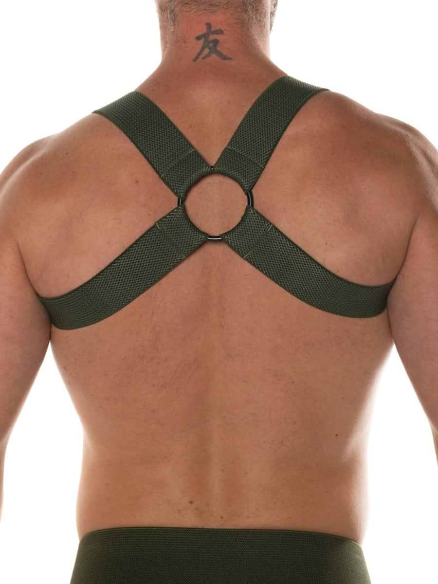 Dark green mesh chevron harness with central circular ring designed for sport use by fk sport