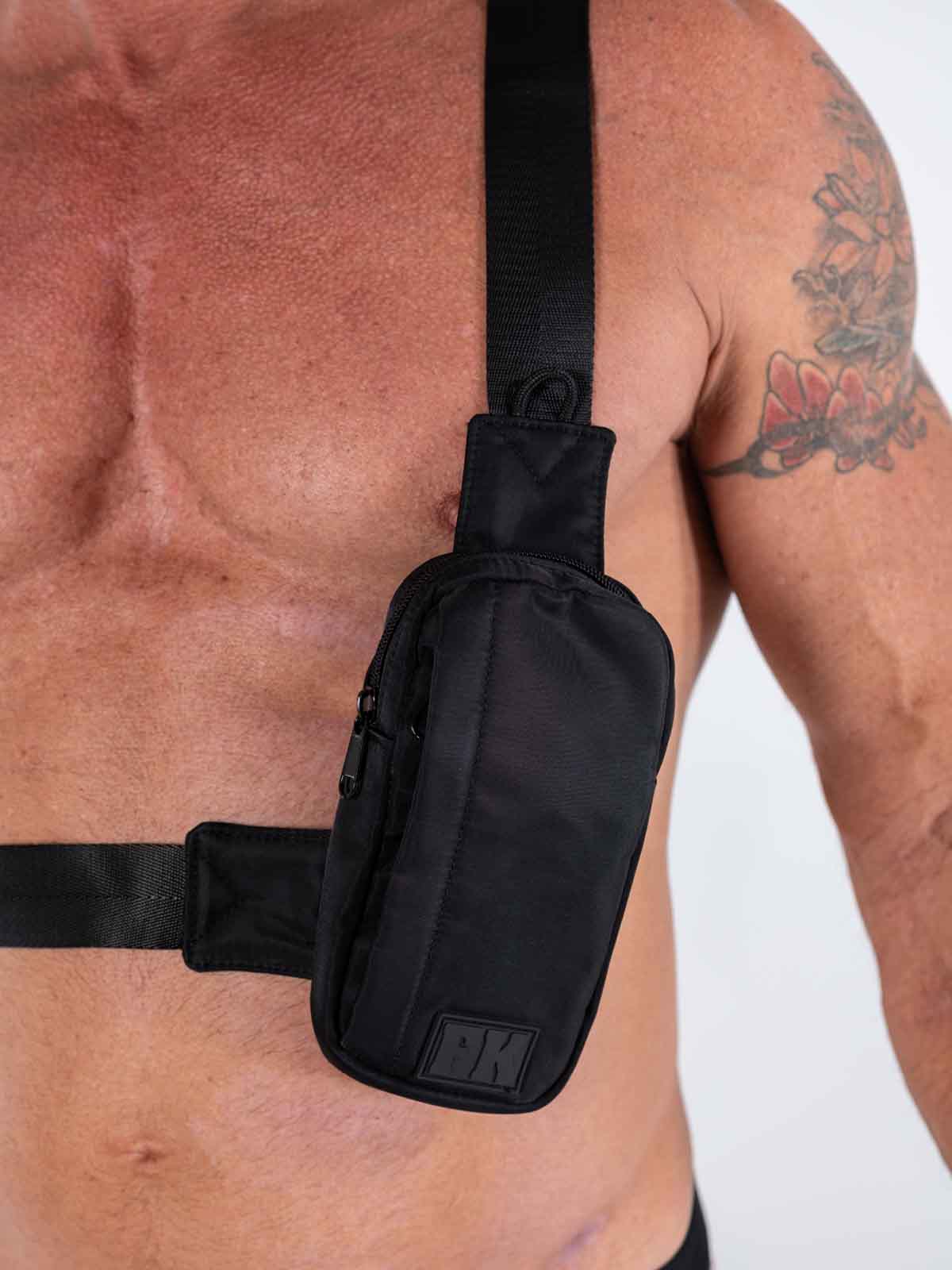 Fk sport crossbody bag in black nylon with subtle textured finish and small rectangular logo patch on front