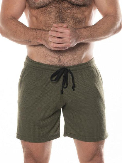 Olive green fk sport swinger shorts with waffle-knit texture and black drawstring waistband for casual wear