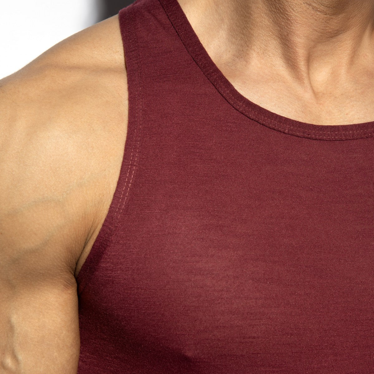 Maroon ribbed flame tank top with simple round neckline made from soft stretchy fabric for casual wear