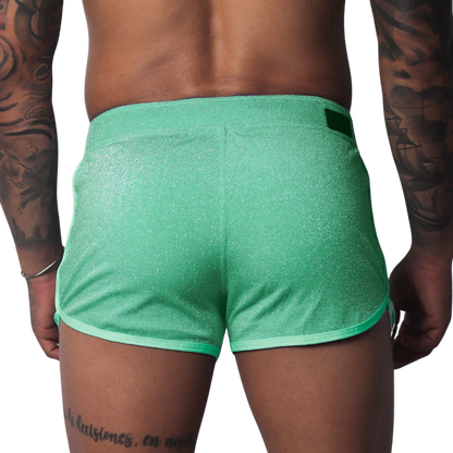 Flash green, shimmering athletic-style shorts with contrast trim and a rear waistband tab.
