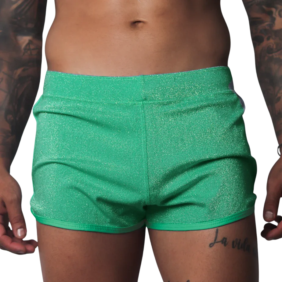 Flash green, form-fitting glittery athletic shorts with a clean hem and elastic waistband.