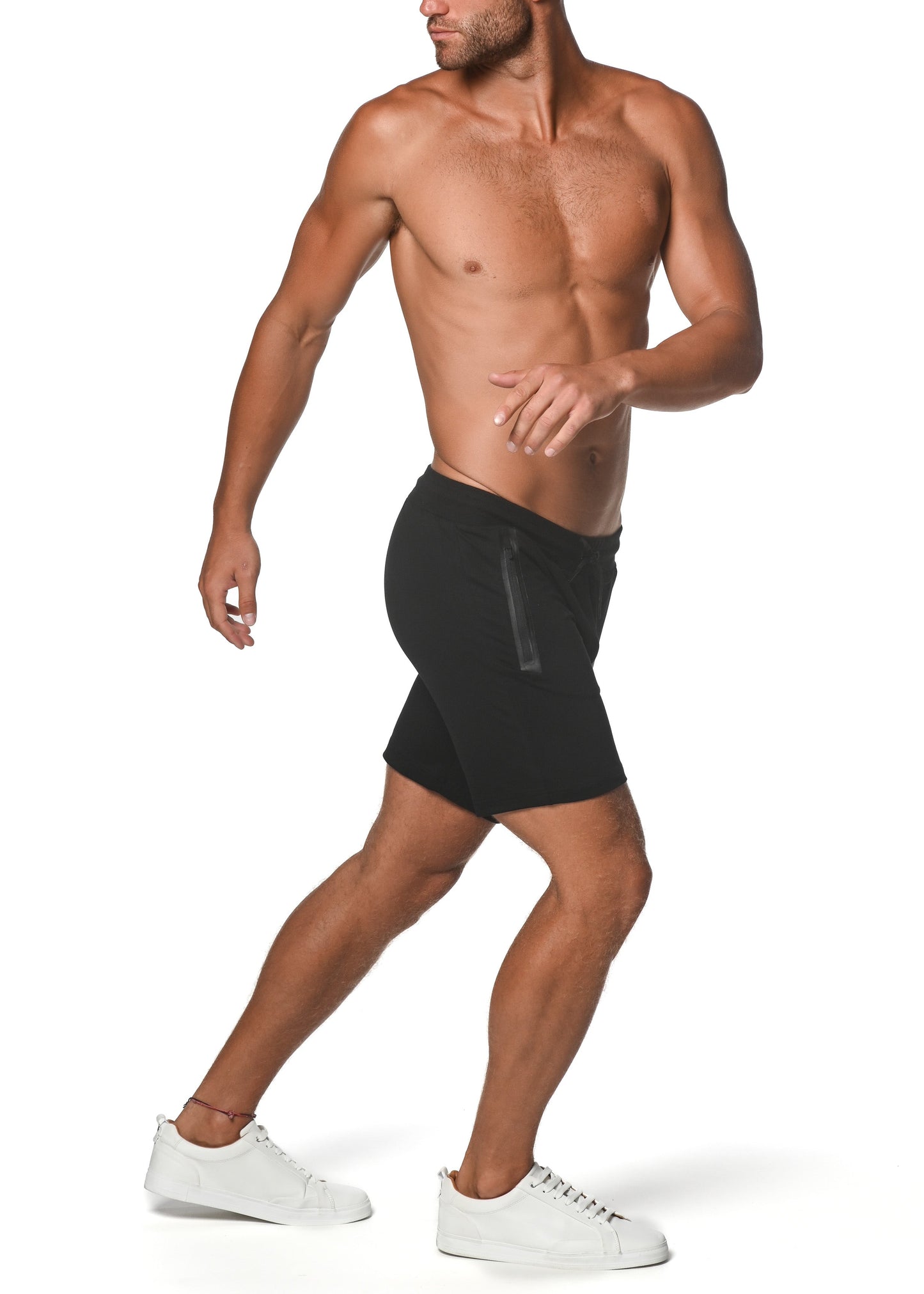 Black fleece flex-cotton stretch shorts with subtle vertical zipper detail on the side for athletic wear