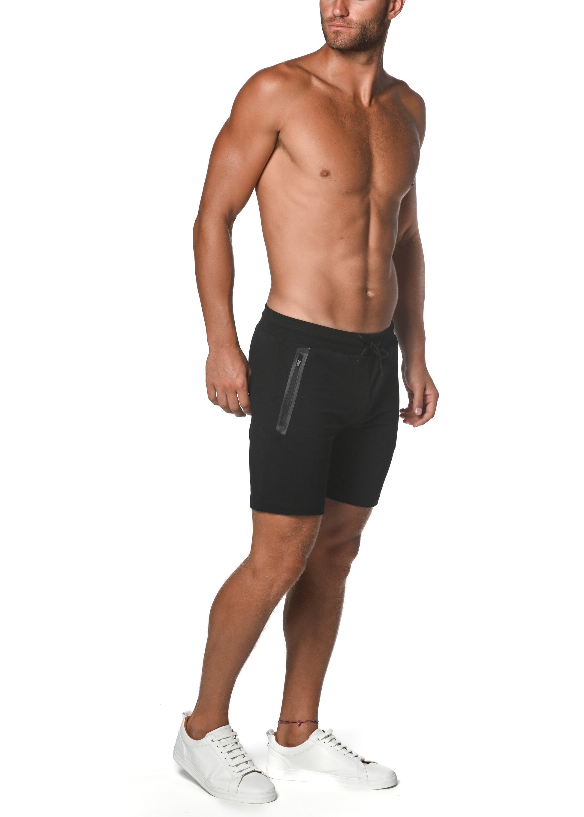 Black fleece flex-cotton stretch shorts with a sleek modern design and subtle vertical side zipper detail