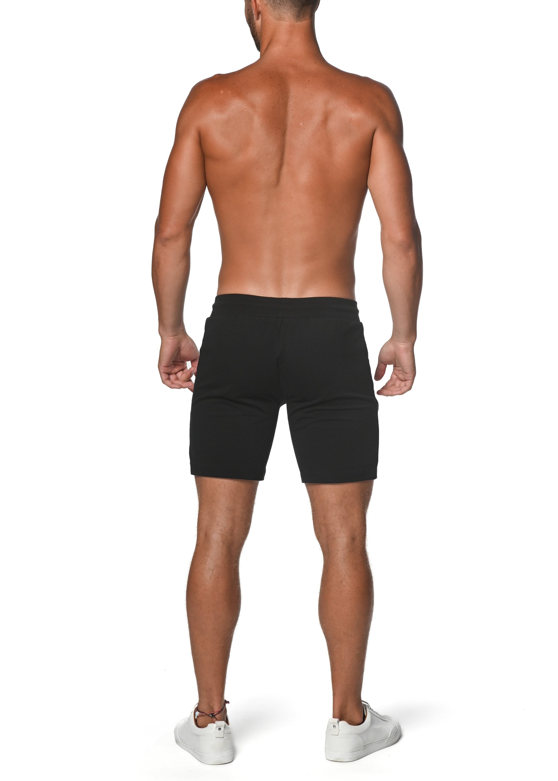 Black fleece flex-cotton stretch shorts with a sleek form-fitting design ideal for athletic wear