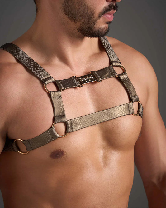 Taupe snakeskin-patterned flex harness with gold-toned metal rings and branded buckle front view