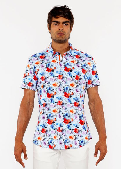 A white floral 3d print stretch knit shirt with bold red and blue blossoms and delicate pink accents