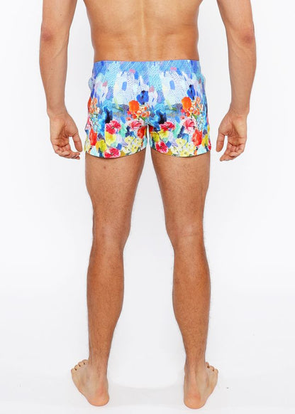 Floral abstract printed swim shorts with vibrant blue orange red and yellow floral pattern perfect for beachwear