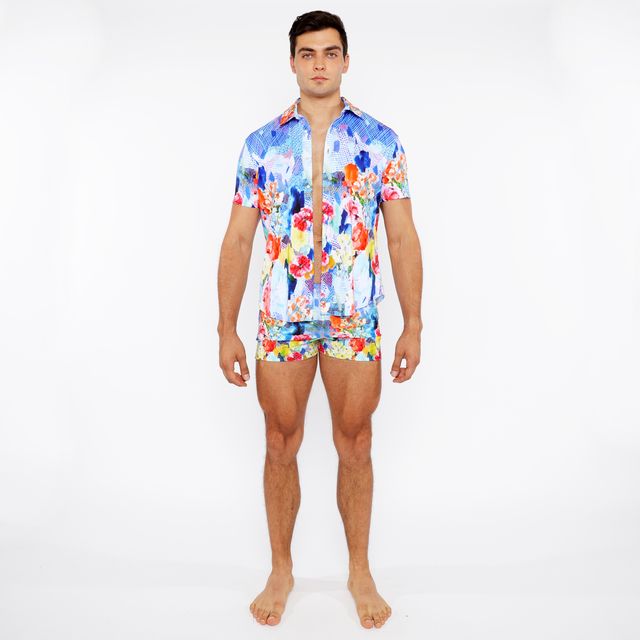 Vibrant blue red and yellow floral abstract printed swim short set with short-sleeved button-up shirt and matching shorts