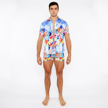 Vibrant blue red and yellow floral abstract printed swim short set with short-sleeved button-up shirt and matching shorts