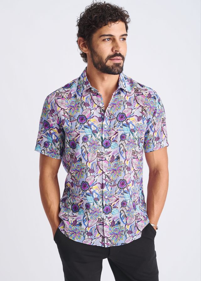 A floral lightweight linen tencel short-sleeved button-up shirt with purple blue and pink pattern on lavender background