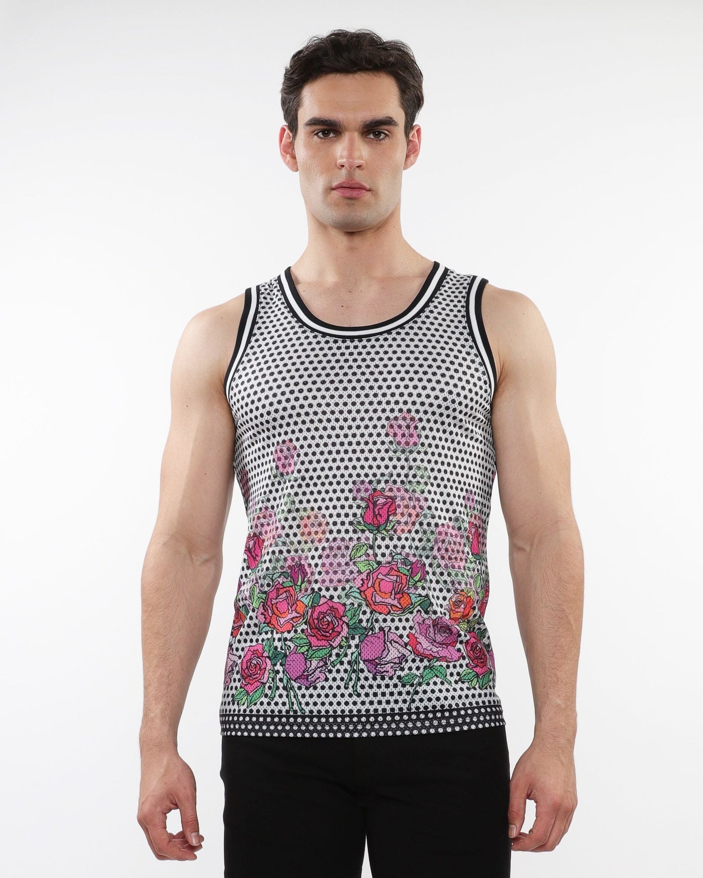 A men’s sleeveless mesh tank top with black and white polka dots and pink red purple floral prints with stripe ribbing