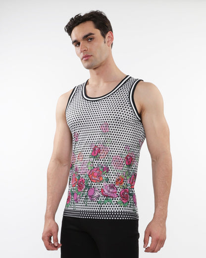 A men’s sleeveless floral printed mesh tank with pink and red roses on black-and-white polka dot base and black trim