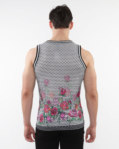 A man wearing a black and white floral printed mesh tank with stripe ribbing and pink roses along the bottom