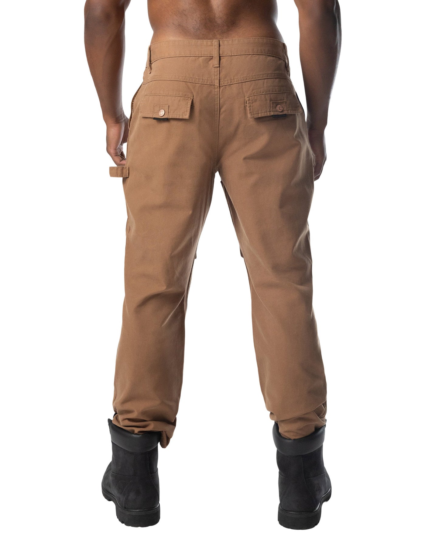 Back view of tan forge pant cargo pants with two flap pockets and tool loop at the waistband for utility use