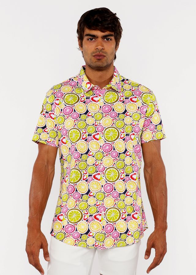 A vibrant fruits print stretch knit short-sleeved polo shirt with lime and pink citrus slices on light yellow background