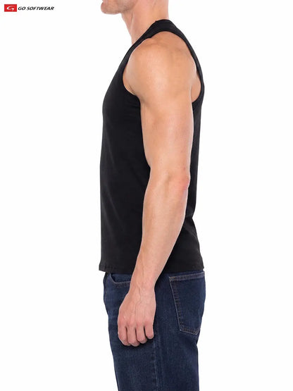 A model wearing a black tank top from Go Softwear showcasing a fitted style and muscular silhouette paired with blue jeans