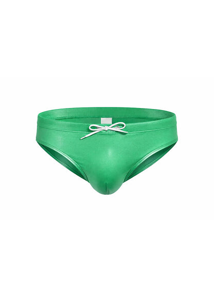 Vibrant green glossy faux leather swim trunks with white drawstring bow in fizx swim bikini with removable push pad