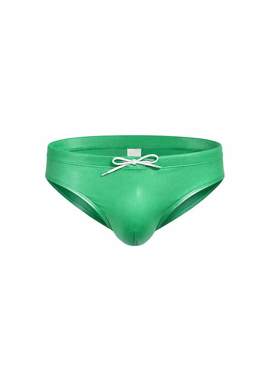 Vibrant green glossy faux leather swim trunks with white drawstring bow in fizx swim bikini with removable push pad