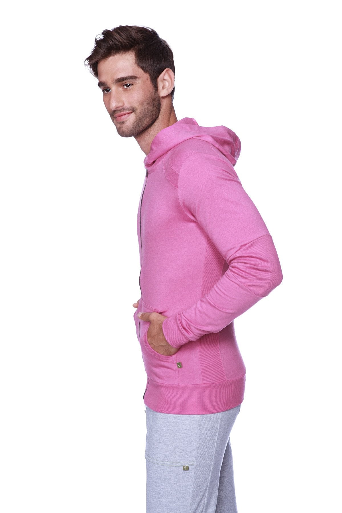 A vibrant pink long-sleeved form-fit crossover yoga track performance hoodie with drawstring hood and front pockets