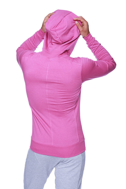 A vibrant pink form-fit crossover yoga track performance hoodie with long sleeves ribbed cuffs and fitted silhouette