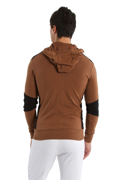 Form-fit crossover yoga track performance hoodie in chocolate with black contrast panels on shoulders and sleeves