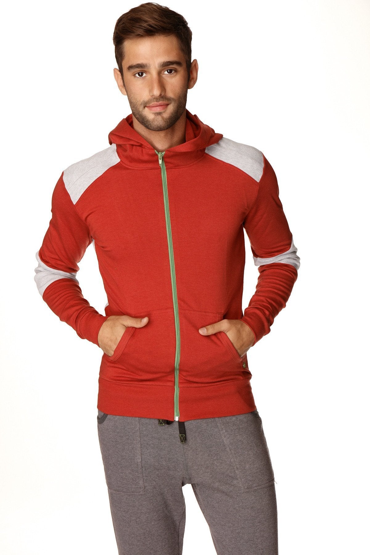 Form-fit crossover yoga track performance hoodie in red and white color block with gold zipper in cinnabar grey fabric