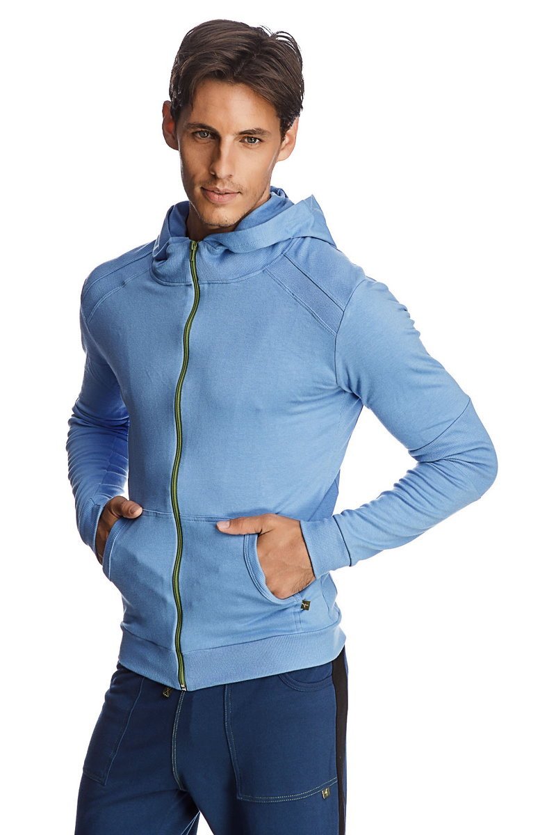 Form-fit crossover yoga track performance hoodie in ice blue with green zipper and textured shoulder panels