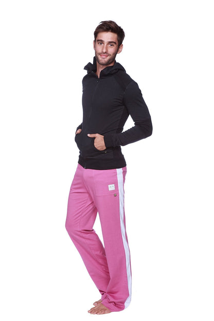 Pink athletic pants with white side stripe and logo patch paired with form-fit crossover yoga track hoodie in solid black