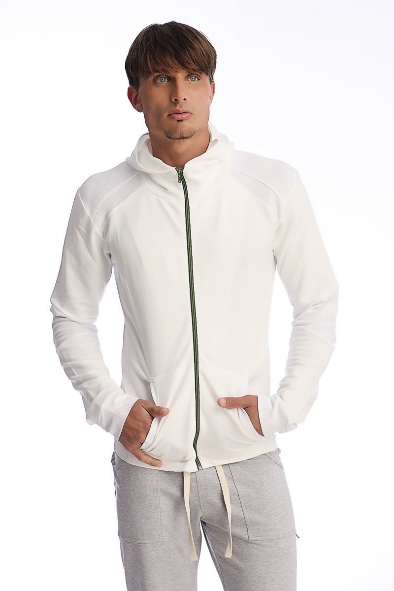 Form-fit crossover yoga track performance hoodie in white with a subtle green zipper and ribbed cuffs