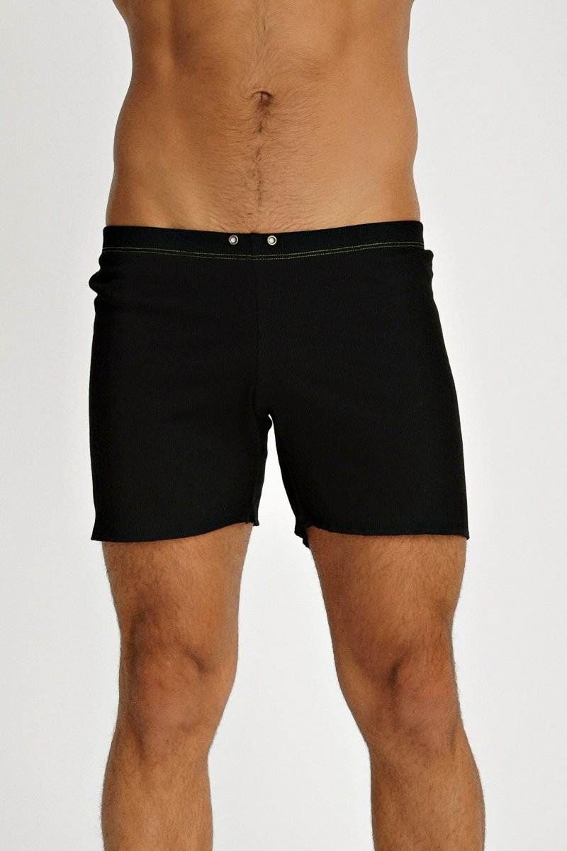 Black fusion yoga short swim trunks with sleek minimalist design and subtle waistband stitching for activewear use