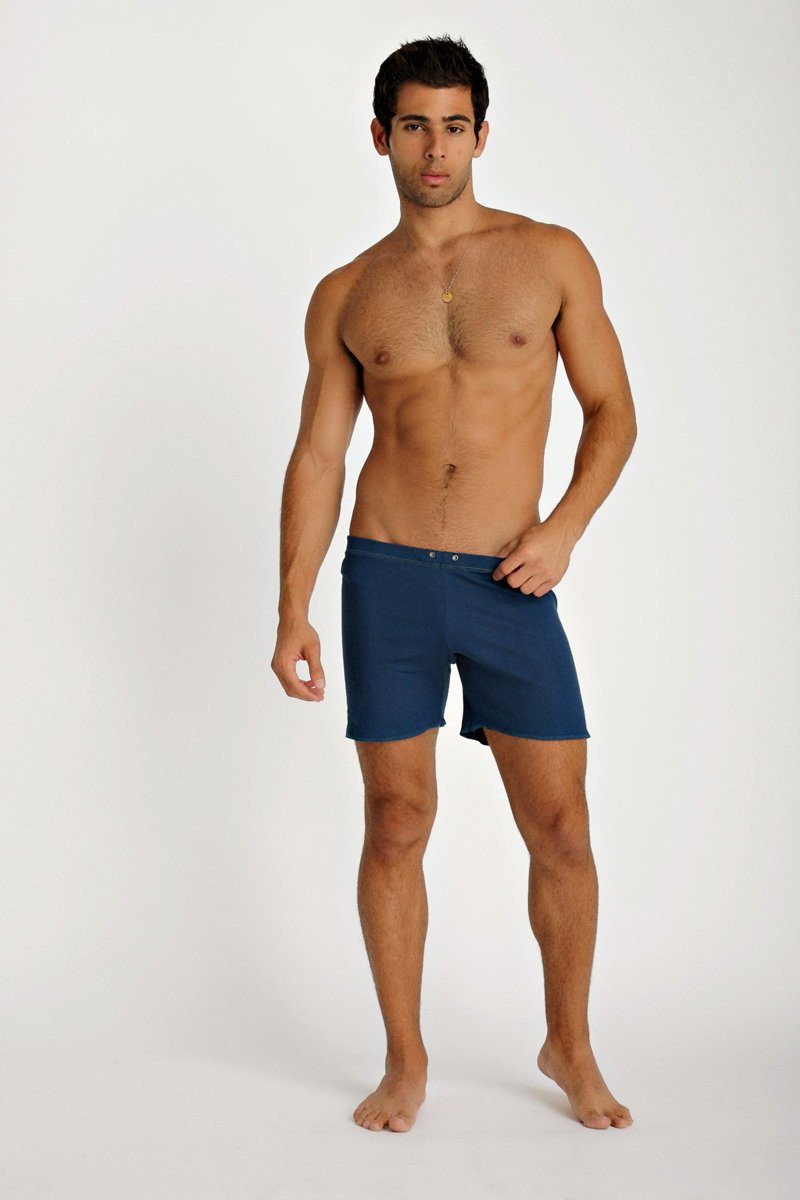 Navy blue fusion yoga shorts with a simple design and button closure at the waist for comfortable swimwear