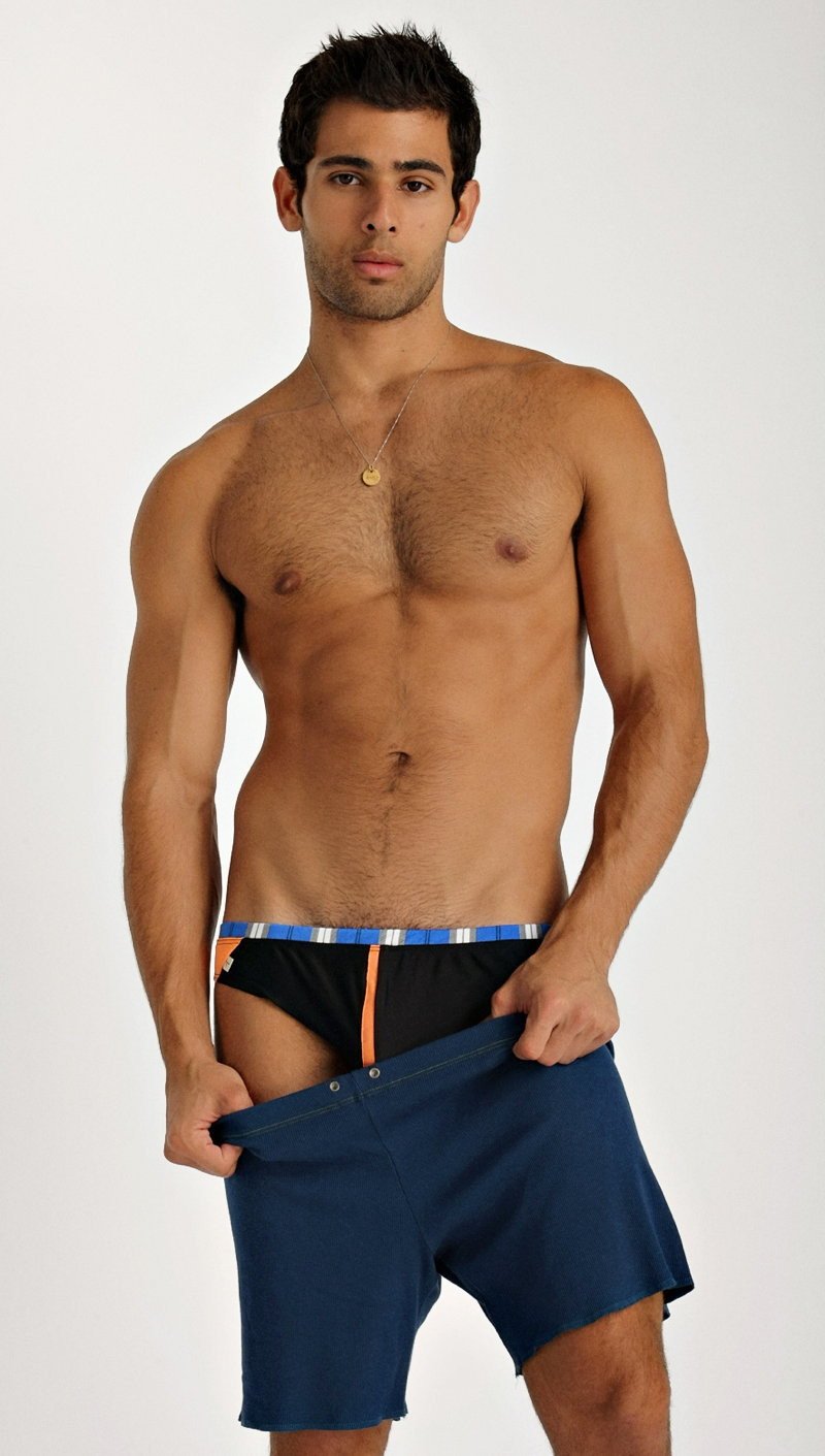 Navy blue fusion yoga shorts with striped waistband and orange side accents designed for active wear