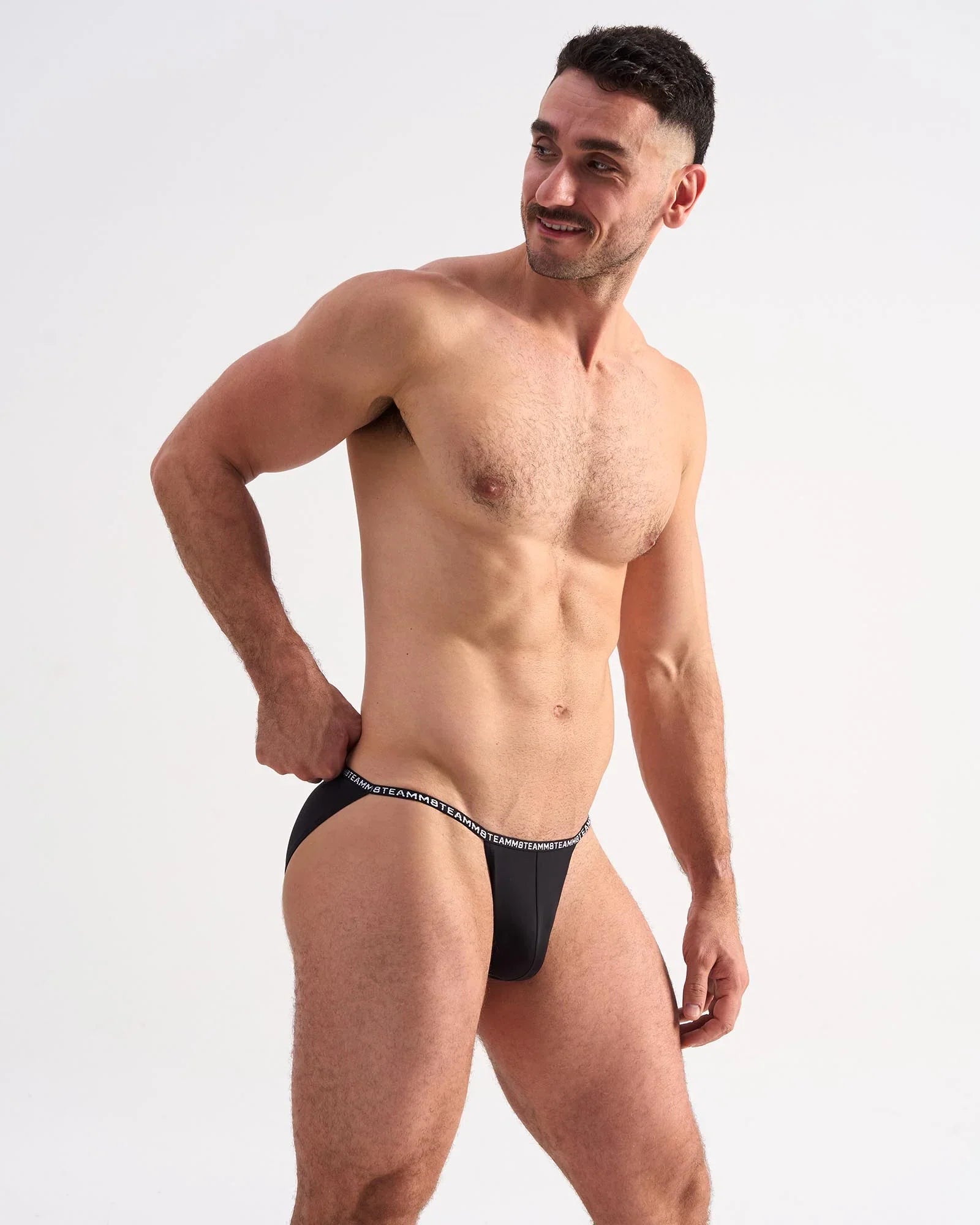Black glide micro brief with a white elastic waistband featuring repeating text for comfortable daily wear