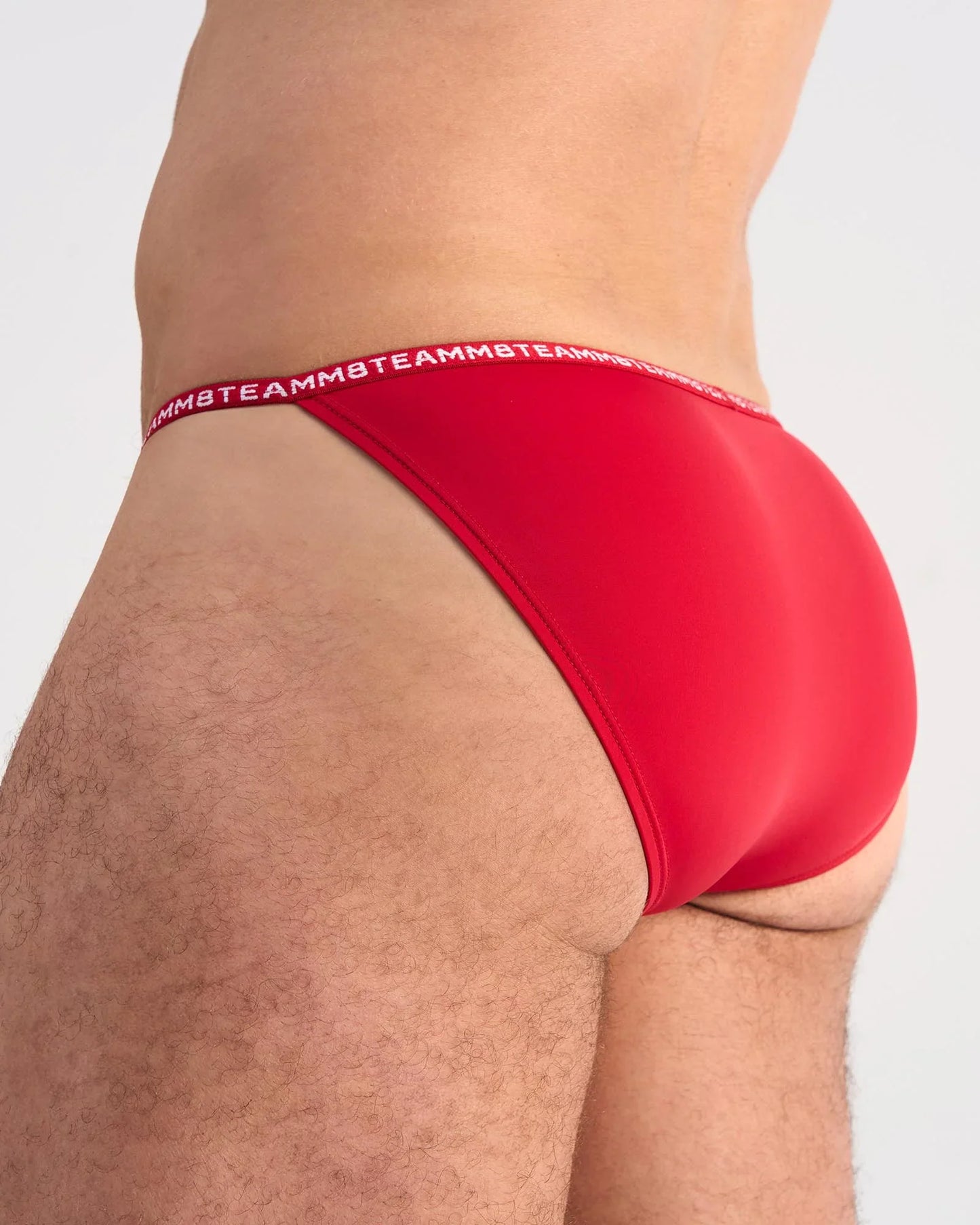 Red glide micro brief with white teammb logo waistband featuring breathable microfiber fabric for active wear