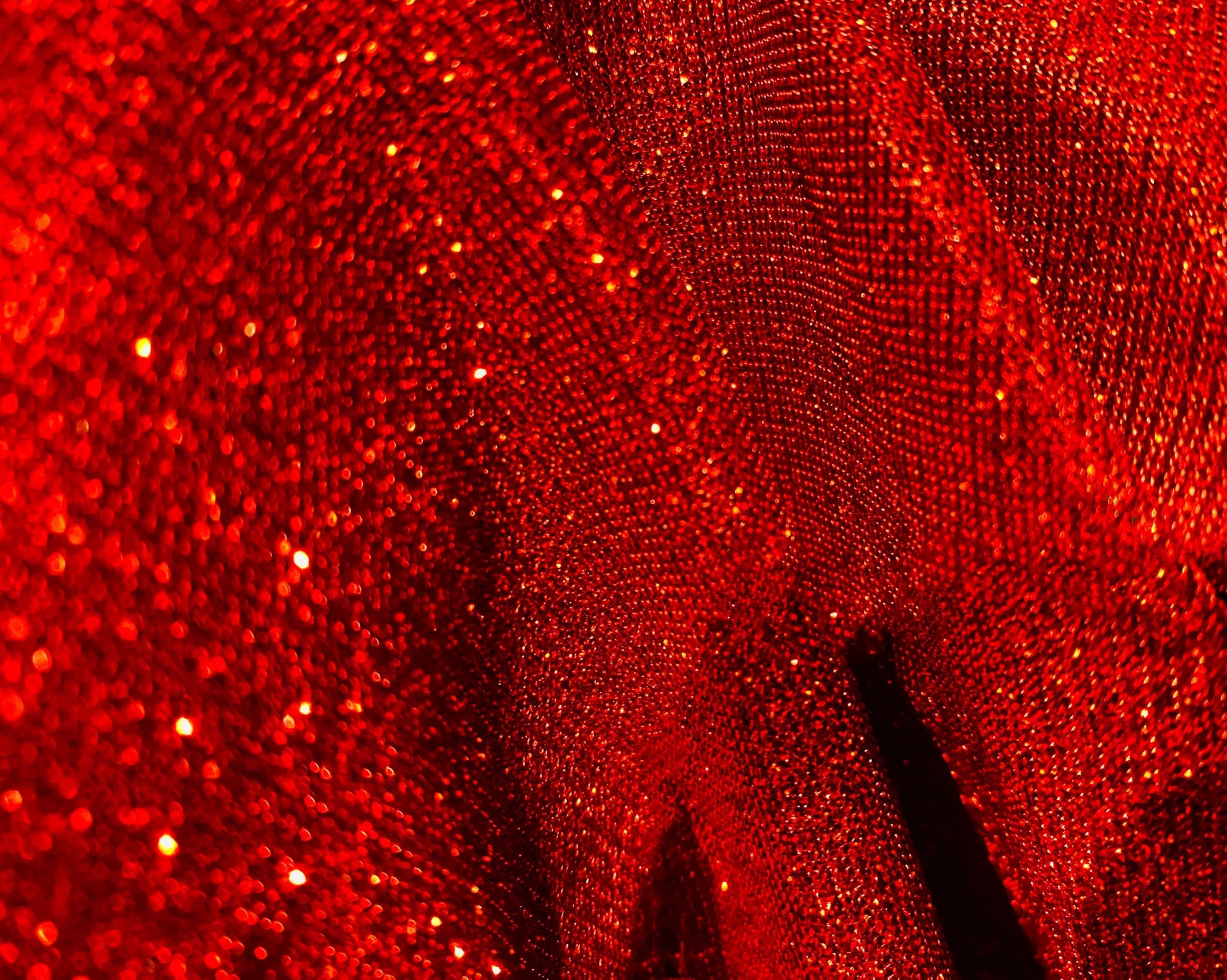 Vibrant red glitter tee with textured shimmering fabric perfect for eye-catching casual wear