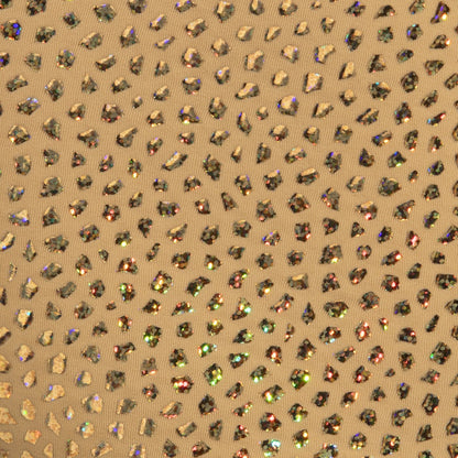Gold stones trunk fabric features gold-toned material with iridescent rhinestones in a leopard print pattern