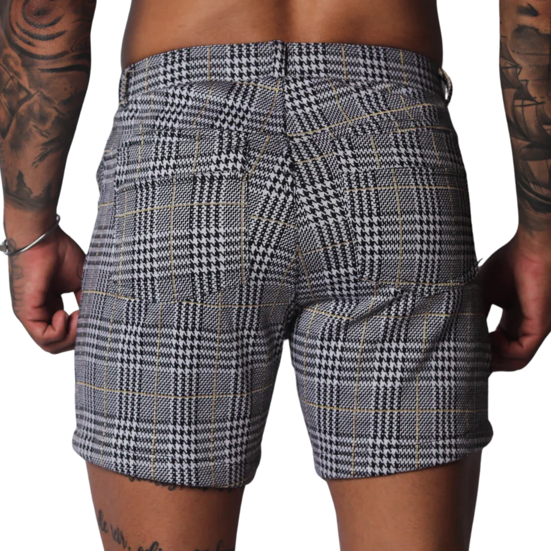 Black and white houndstooth print shorts with a subtle gold windowpane check pattern and two rear pockets.