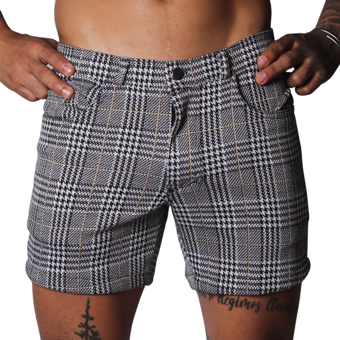 Black and white houndstooth print shorts with a subtle gold windowpane check, featuring a classic five-pocket design.