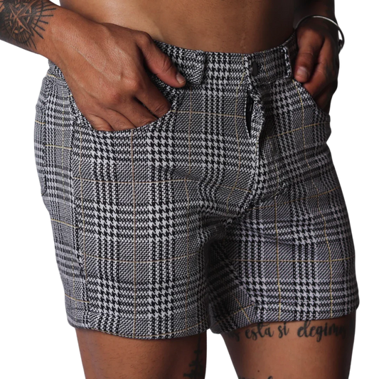 Men's slim-fit shorts in a black and white houndstooth glen plaid pattern with subtle gold thread accents.
