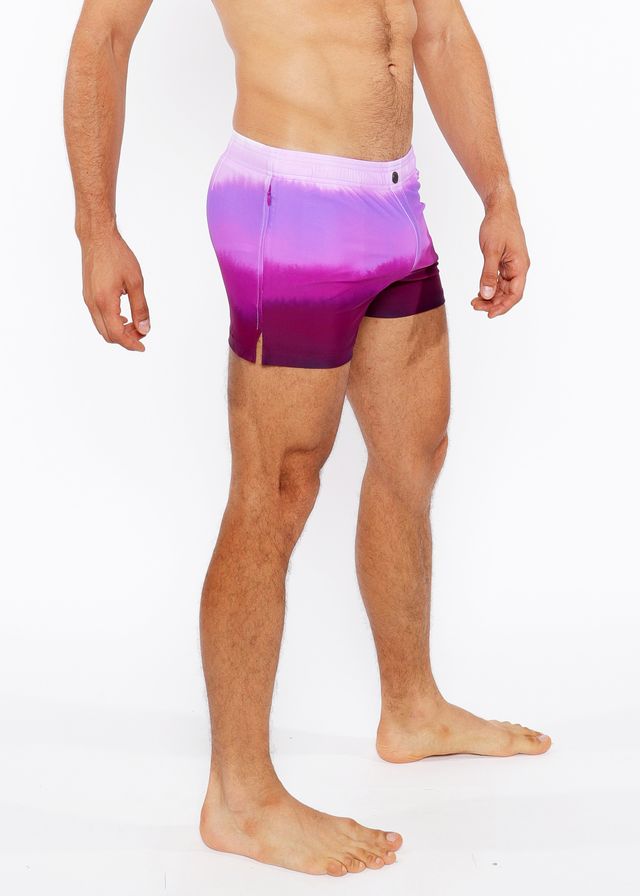 Gradient printed swim short in purple with white to purple tie dye pattern and side slit for comfortable wear