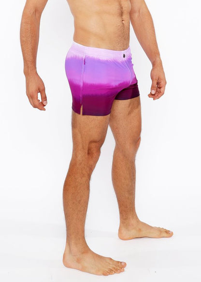 Gradient printed swim short in purple with white to purple tie dye pattern and side slit for comfortable wear