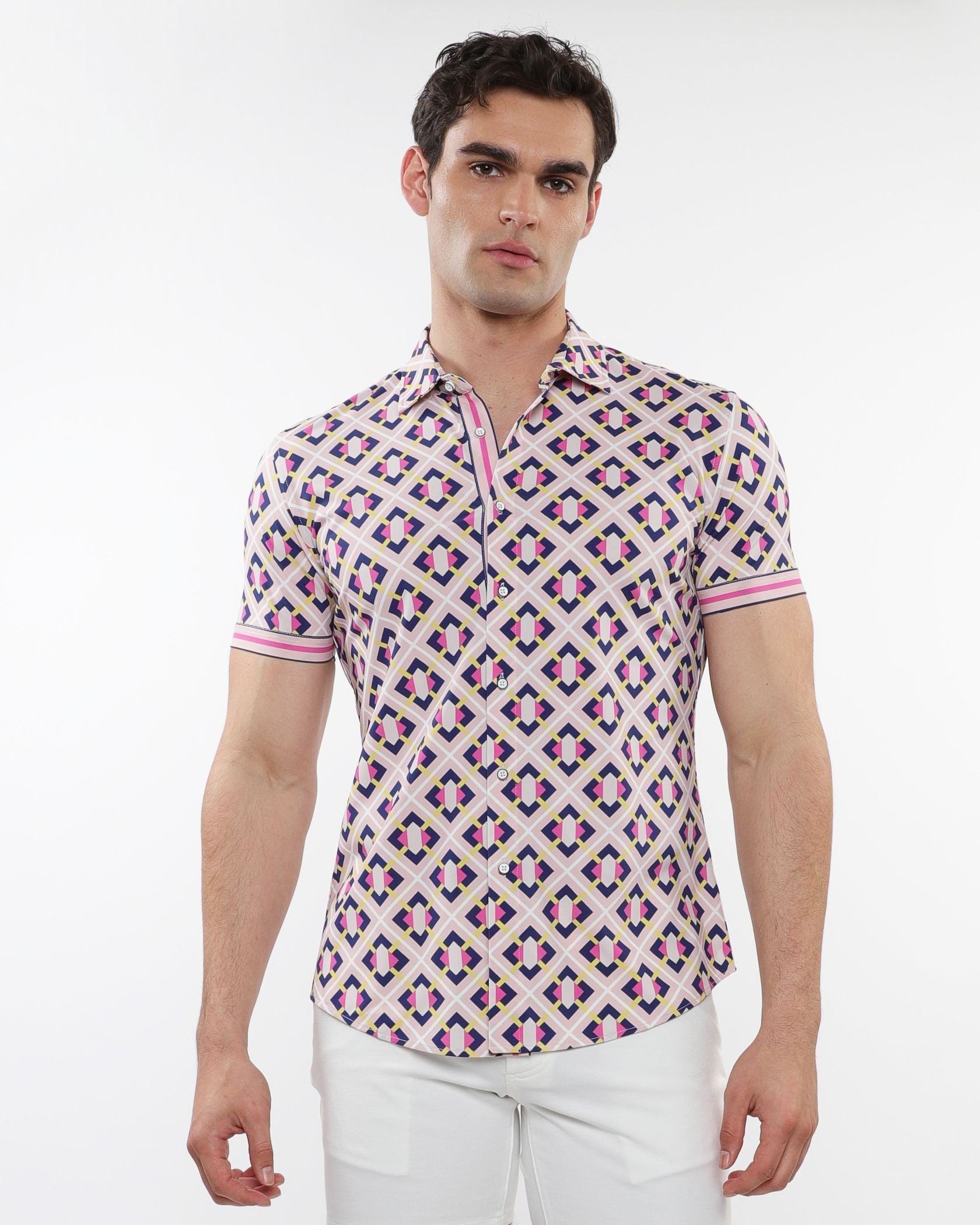 A man wearing a grid parquet printed performance short-sleeved shirt with pink purple and beige geometric pattern