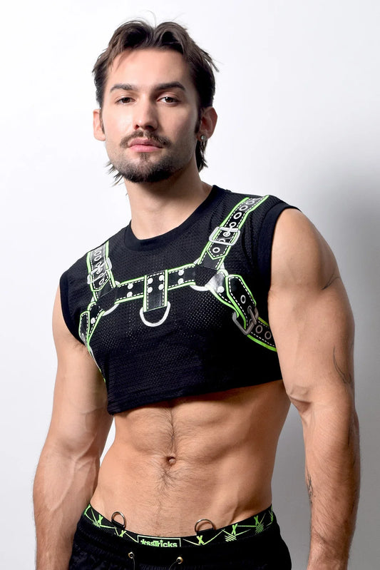 Black mesh harness crop top with neon green leather-like straps and silver hardware front view