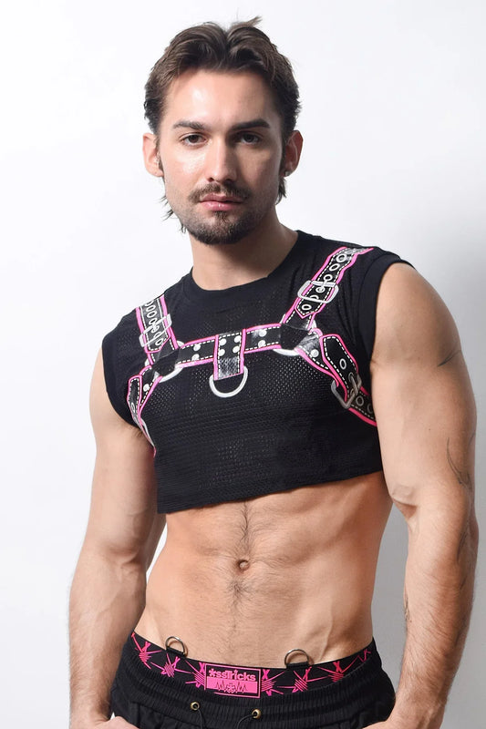 Black mesh harness crop top with pink and black straps featuring silver hardware and edgy design details