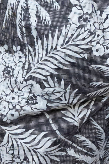 Black fabric hawaiian print swim short with white tropical palm trees flowers and leaves pattern