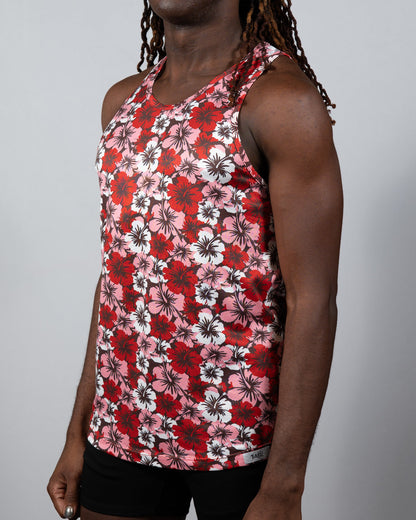 A vibrant red pink and white hawaiian hibiscus print tank top with a racerback design perfect for summer wear