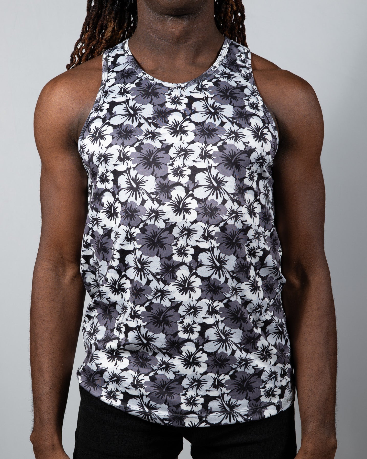 Black and white floral patterned hawaiian hibiscus print tank top with round neckline for casual wear